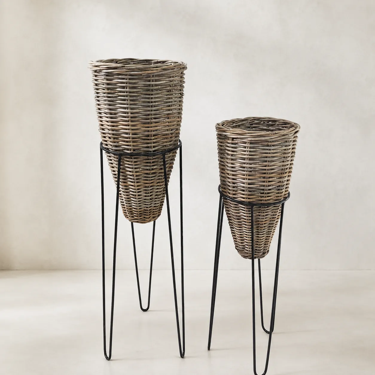 Tall woven planter baskets on stands